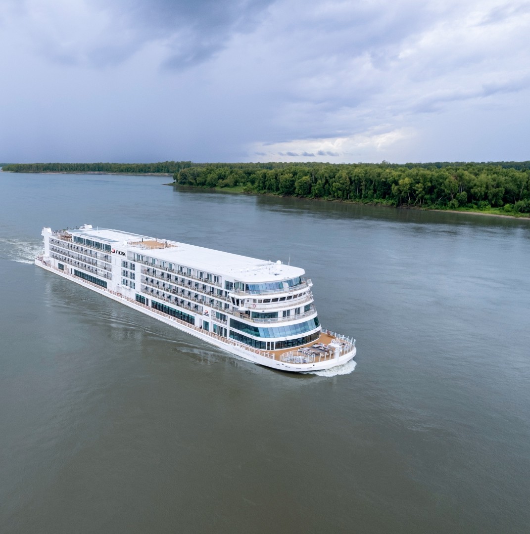 Viking Mississippi cruising along a wide bend of the Mississippi River