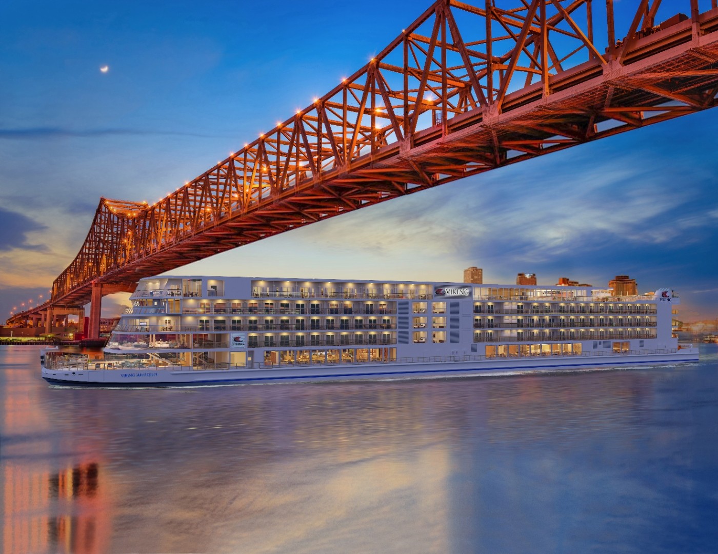 Viking Mississippi passing under the Crescent City Connection bridge at dusk in New Orleans